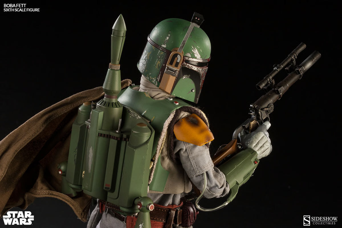 Rear three-quarter view of the Boba Fett sixth-scale figure showing the green jetpack, brown cape, helmet rangefinder, and blaster rifle